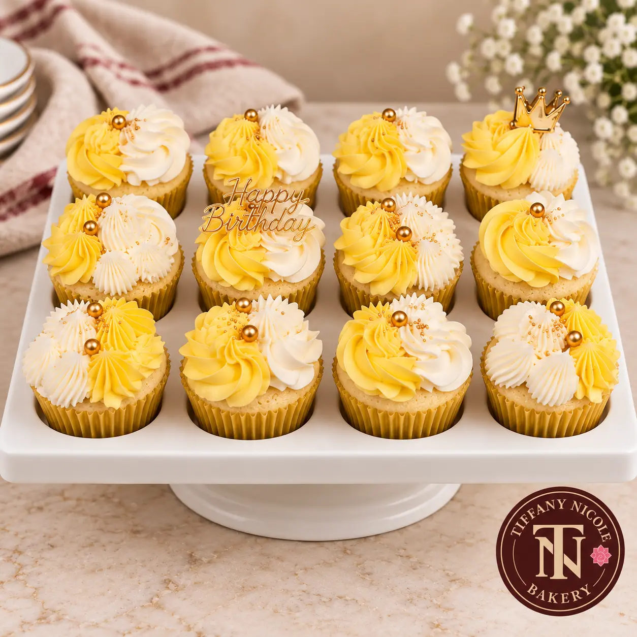 Yellow and white birthday cupcakes with gold pearls, Happy Birthday topper and gold crown