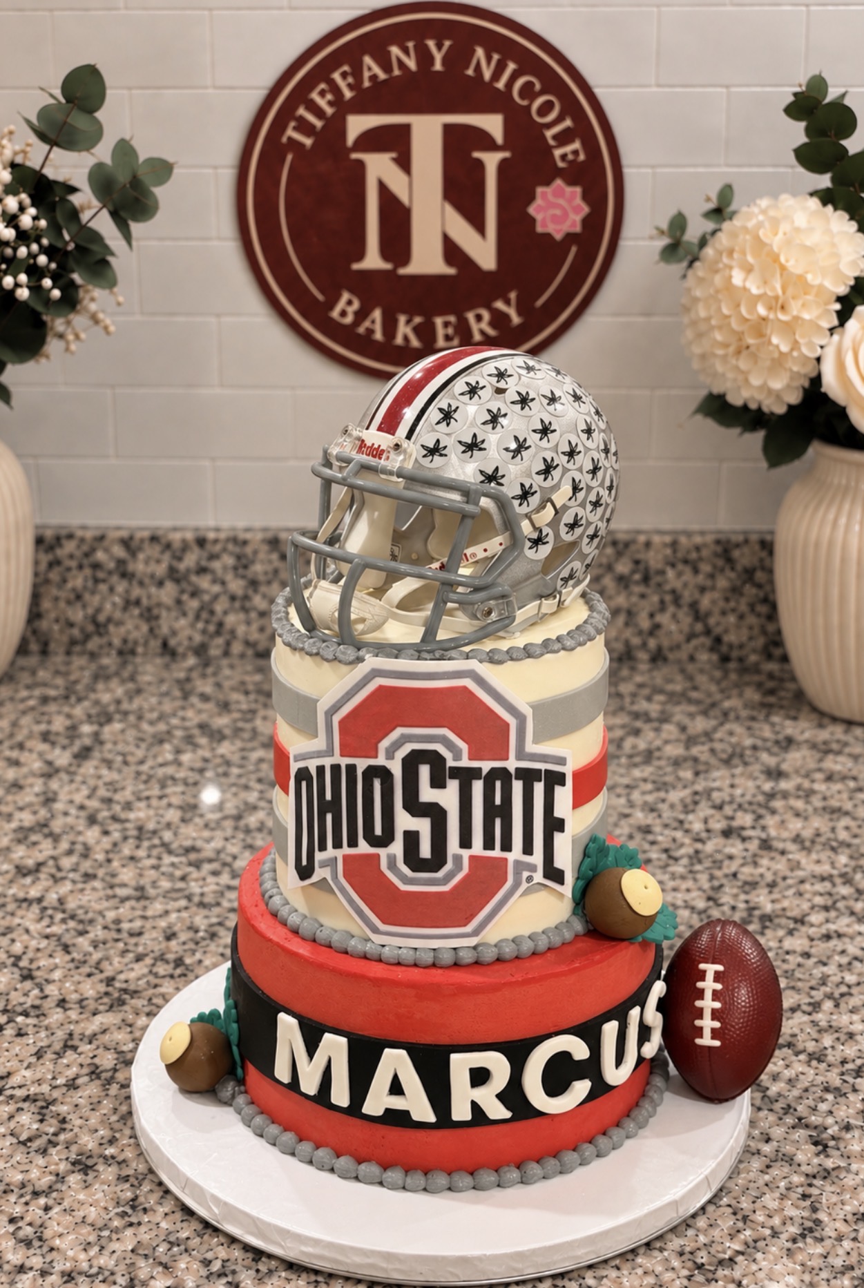 Ohio State themed birthday cake with helmet topper for Marcus
